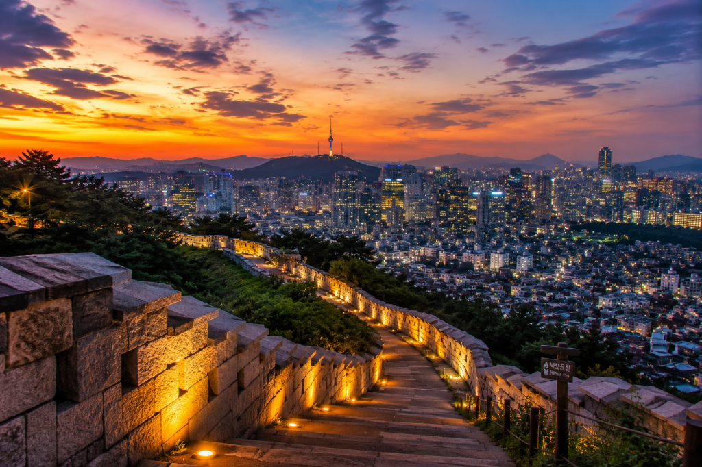 Seoul City Wall at Naksan Park overlooking the Seoul skyline at sunset